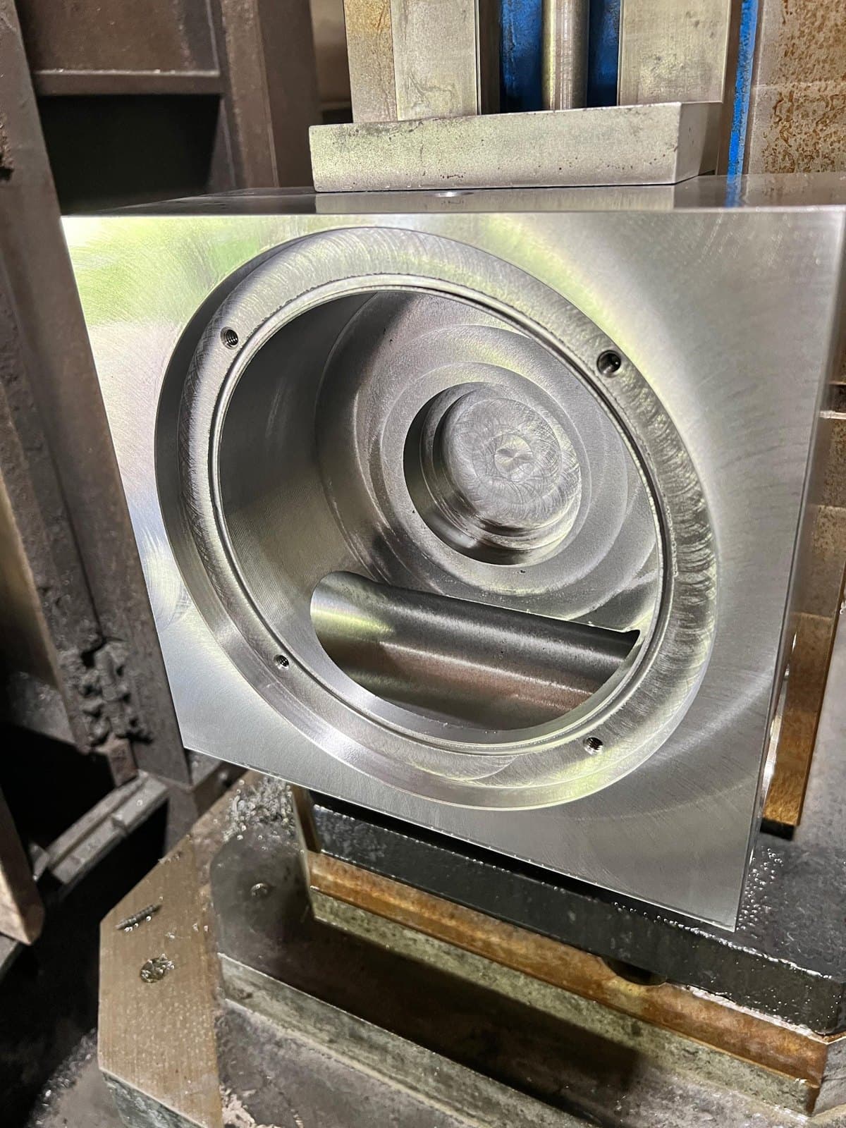 Fully machined railroad gear housing with a large circular bore.